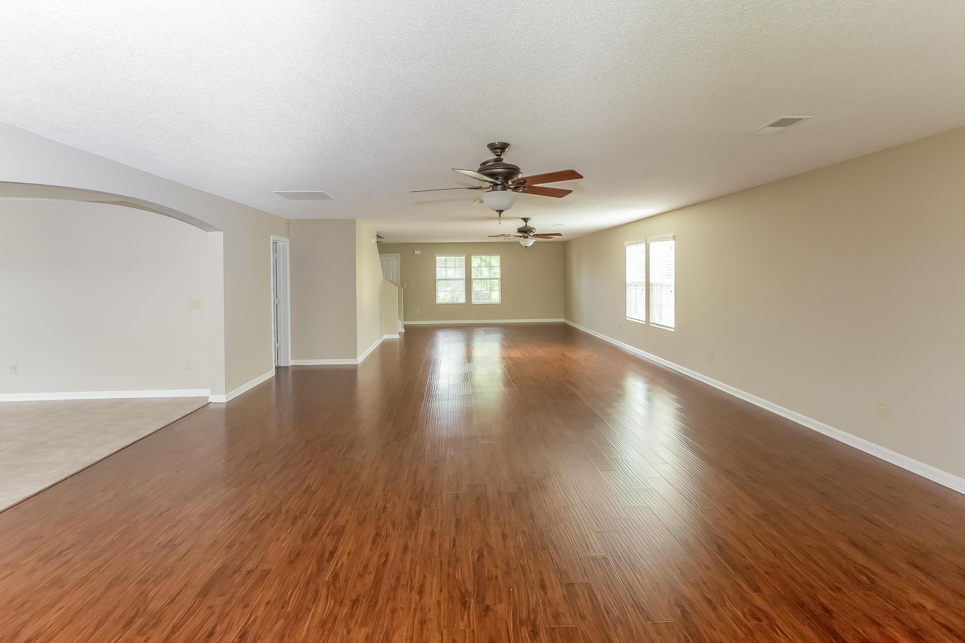 9966 Chariden Drive Cordova, TN 38016 - Photo 2 of 17 an empty room with wooden floor and windows