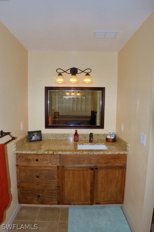 2041 Rialto Way Alva, FL 33920 - Photo 15 of 32 a bathroom with a sink and a mirror