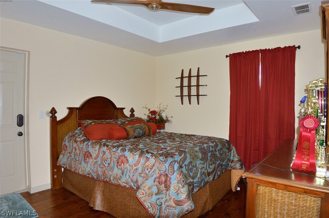 2041 Rialto Way Alva, FL 33920 - Photo 19 of 32 a bedroom with a bed and a closet