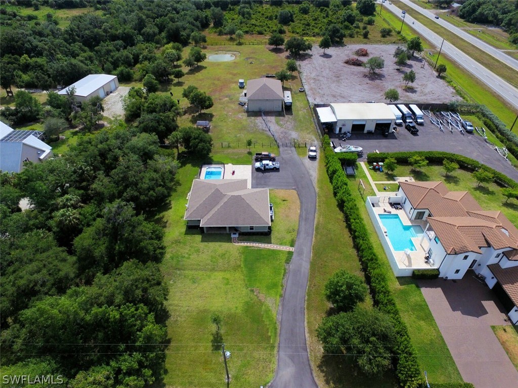 2041 Rialto Way Alva, FL 33920 - Photo 2 of 32 an aerial view of houses with yard