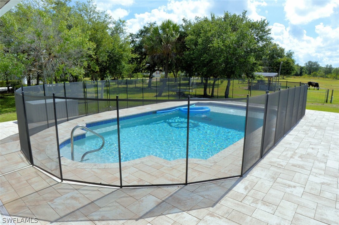 2041 Rialto Way Alva, FL 33920 - Photo 23 of 32 a swimming pool with view of outdoor space