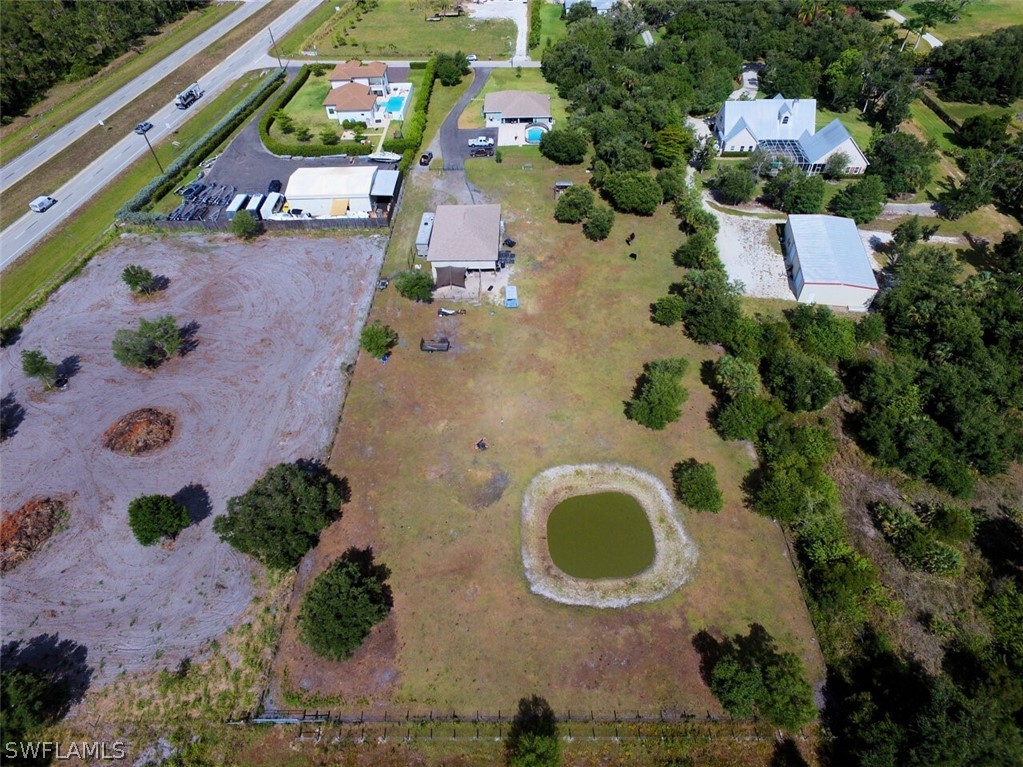 2041 Rialto Way Alva, FL 33920 - Photo 3 of 32 an aerial view of a house with a swimming pool