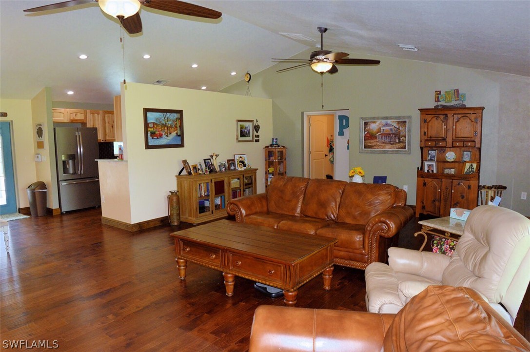 2041 Rialto Way Alva, FL 33920 - Photo 6 of 32 a living room with furniture and kitchen view