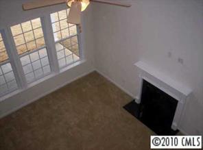 830 Solandra Way Tega Cay, SC 29708 - Photo 4 of 6 an empty room with windows