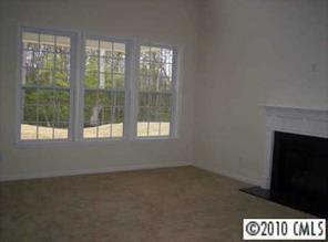 830 Solandra Way Tega Cay, SC 29708 - Photo 5 of 6 a view of wooden floor and windows in a room