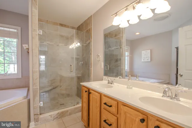 a bath tub sitting in a bathroom next to a window