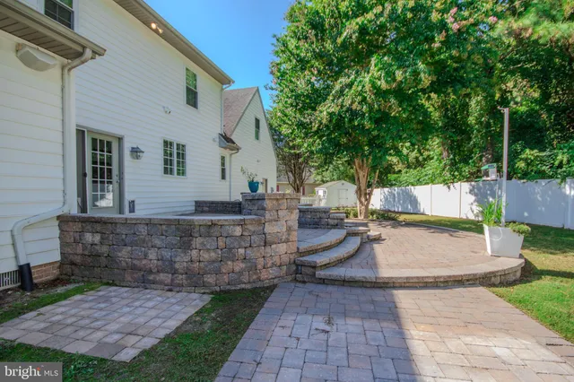 a view of a patio with couches chairs and a fire pit