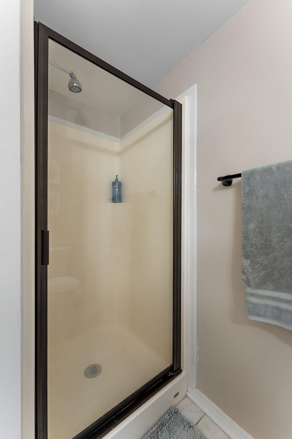 406 Sturdy Road, Unit 1A Valparaiso, IN 46383 - Photo 12 of 16 a bathroom with a glass shower door