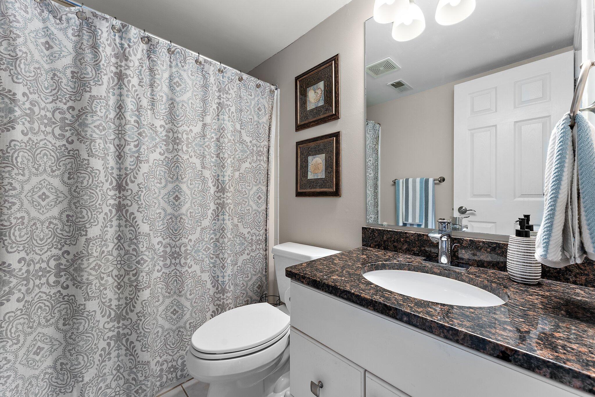 406 Sturdy Road, Unit 1A Valparaiso, IN 46383 - Photo 14 of 16 a bathroom with a granite countertop sink and a mirror with toilet