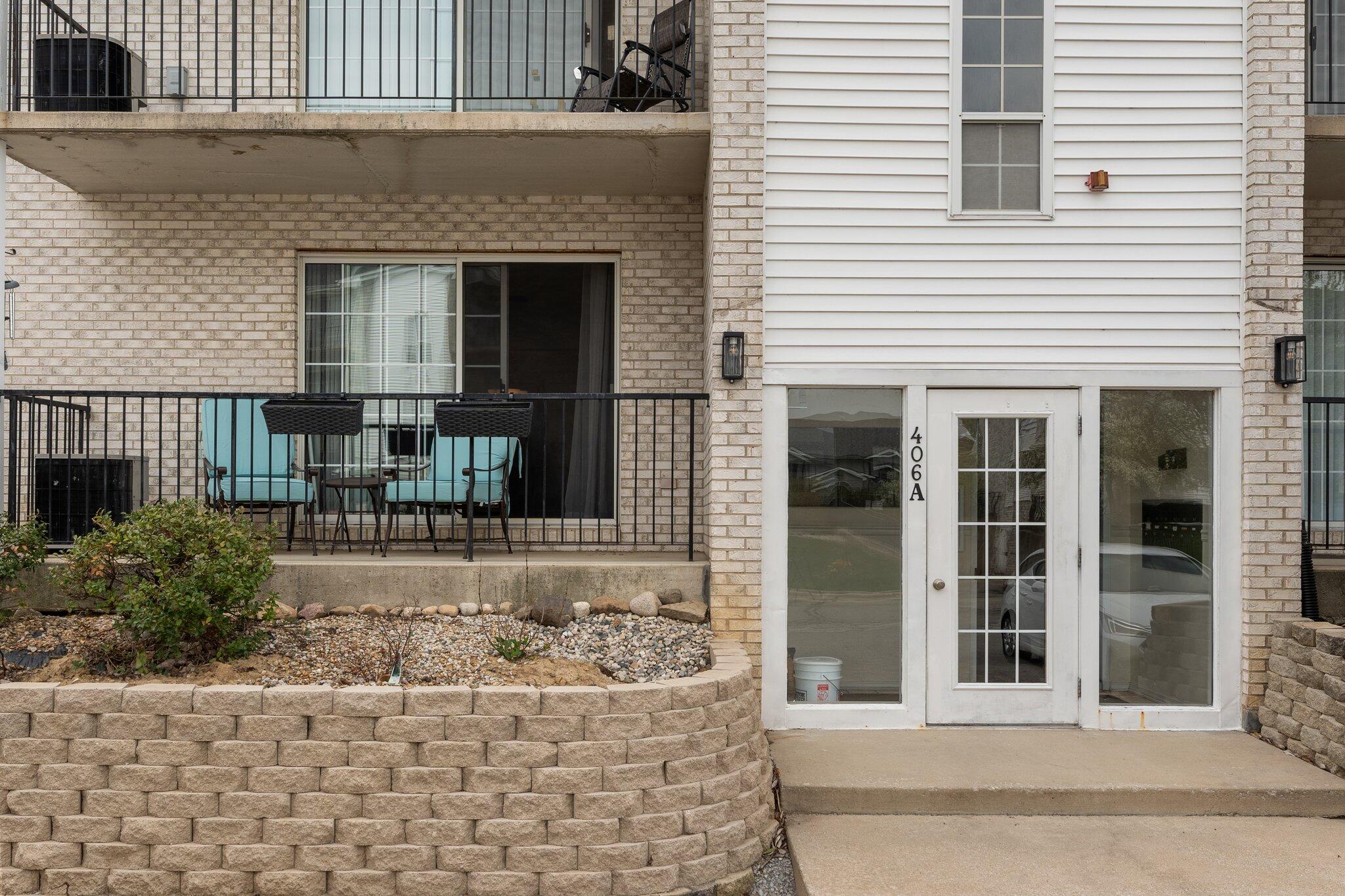 406 Sturdy Road, Unit 1A Valparaiso, IN 46383 - Photo 2 of 16 a front view of a house with a yard
