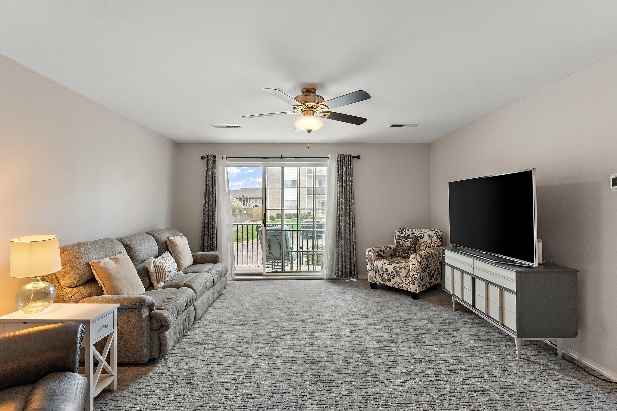 406 Sturdy Road, Unit 1A Valparaiso, IN 46383 - Photo 4 of 16 a living room with furniture and a flat screen tv