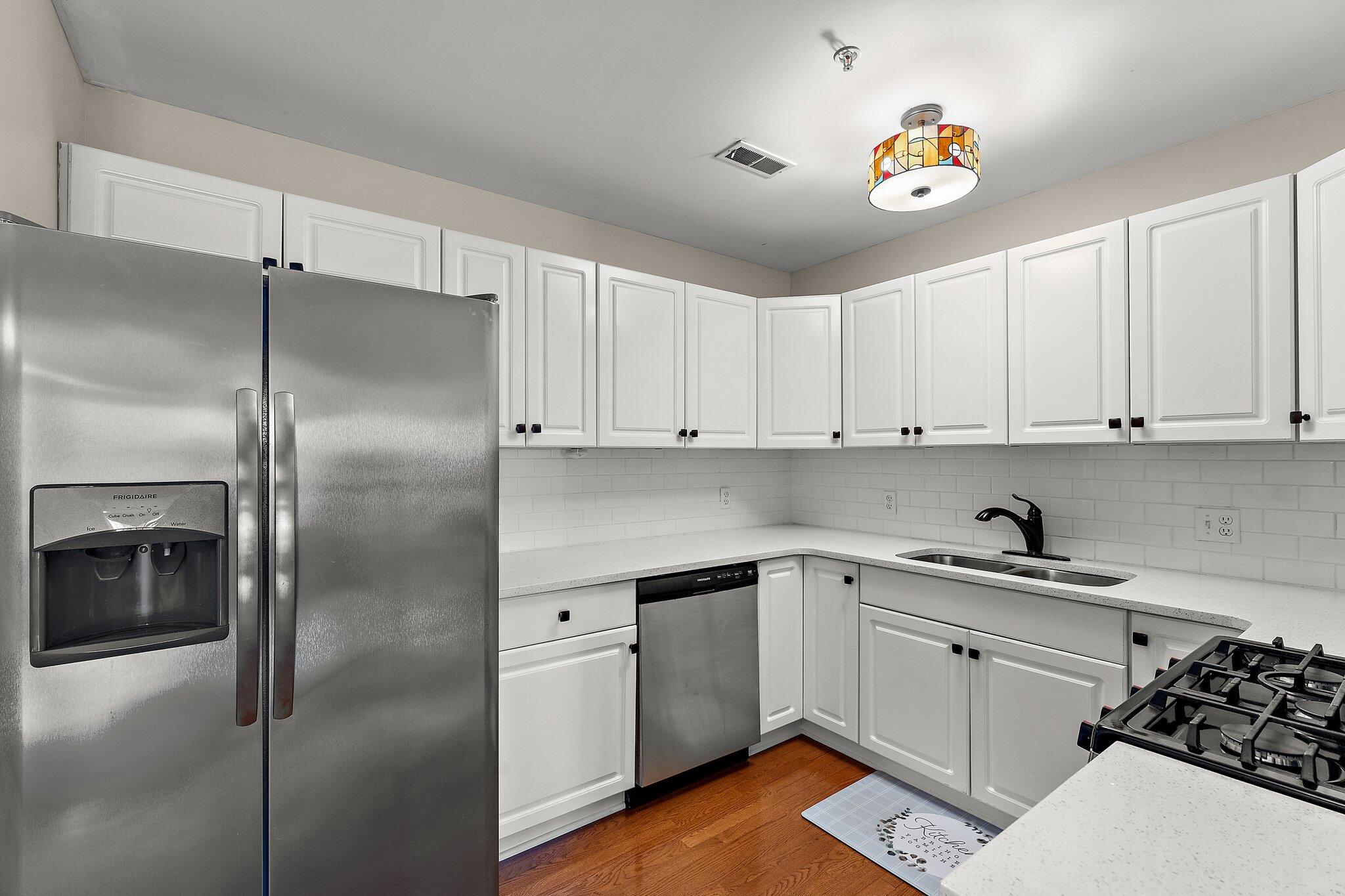 406 Sturdy Road, Unit 1A Valparaiso, IN 46383 - Photo 5 of 16 a kitchen with a sink and refrigerator