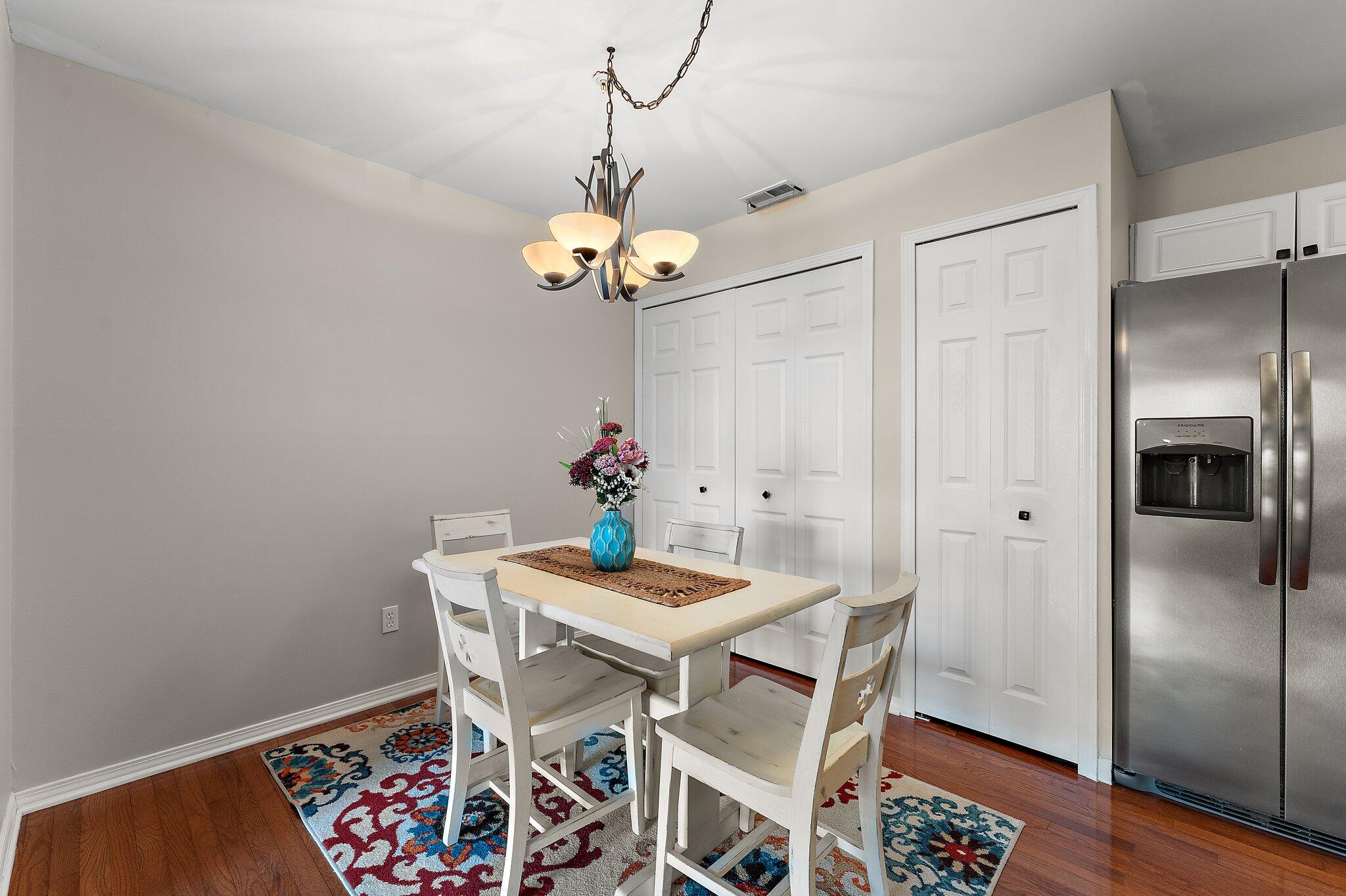 406 Sturdy Road, Unit 1A Valparaiso, IN 46383 - Photo 9 of 16 a view of a dining room with furniture and wooden floor
