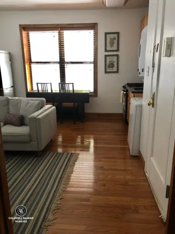 a living room with furniture and a rug