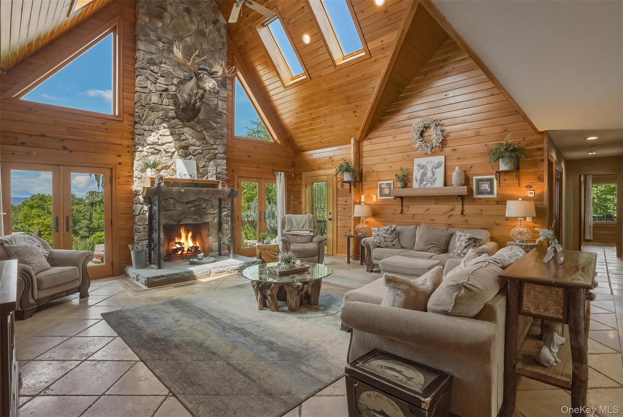95 Judson Road Montgomery, NY 12549 - Photo 12 of 50 The dramatic great room serves as the heart of the home with floor-to-ceiling windows and a striking stone fireplace.