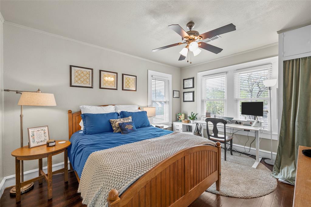 2326 Parrott Avenue Waco, TX 76707 - Photo 26 of 37 a bedroom with a large bed a chandelier and a window