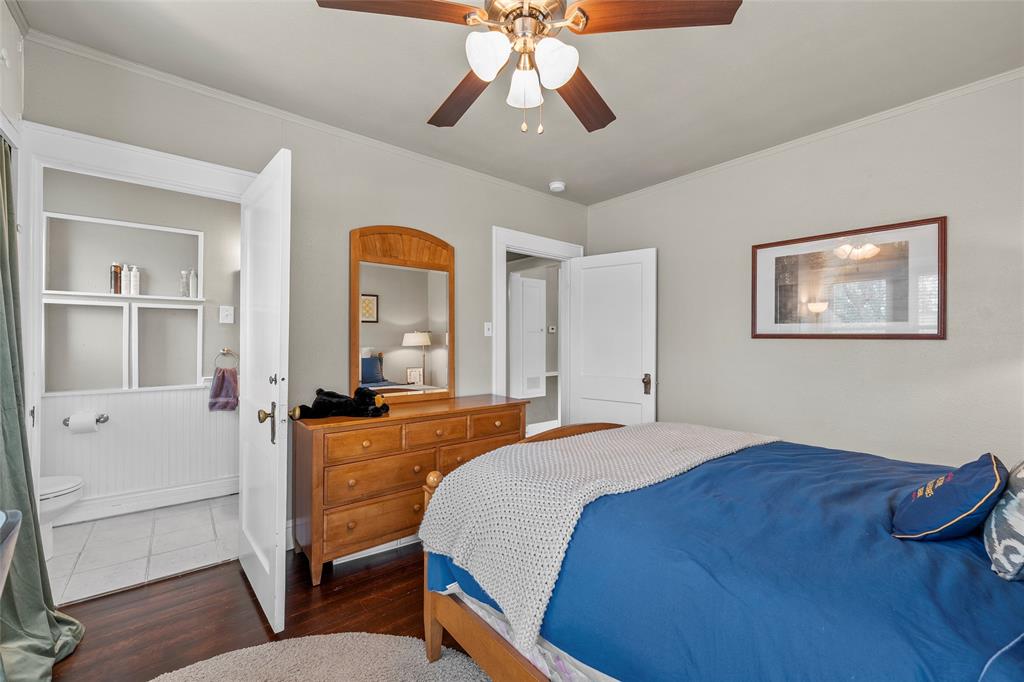 2326 Parrott Avenue Waco, TX 76707 - Photo 27 of 37 a bedroom with a bed and a chandelier