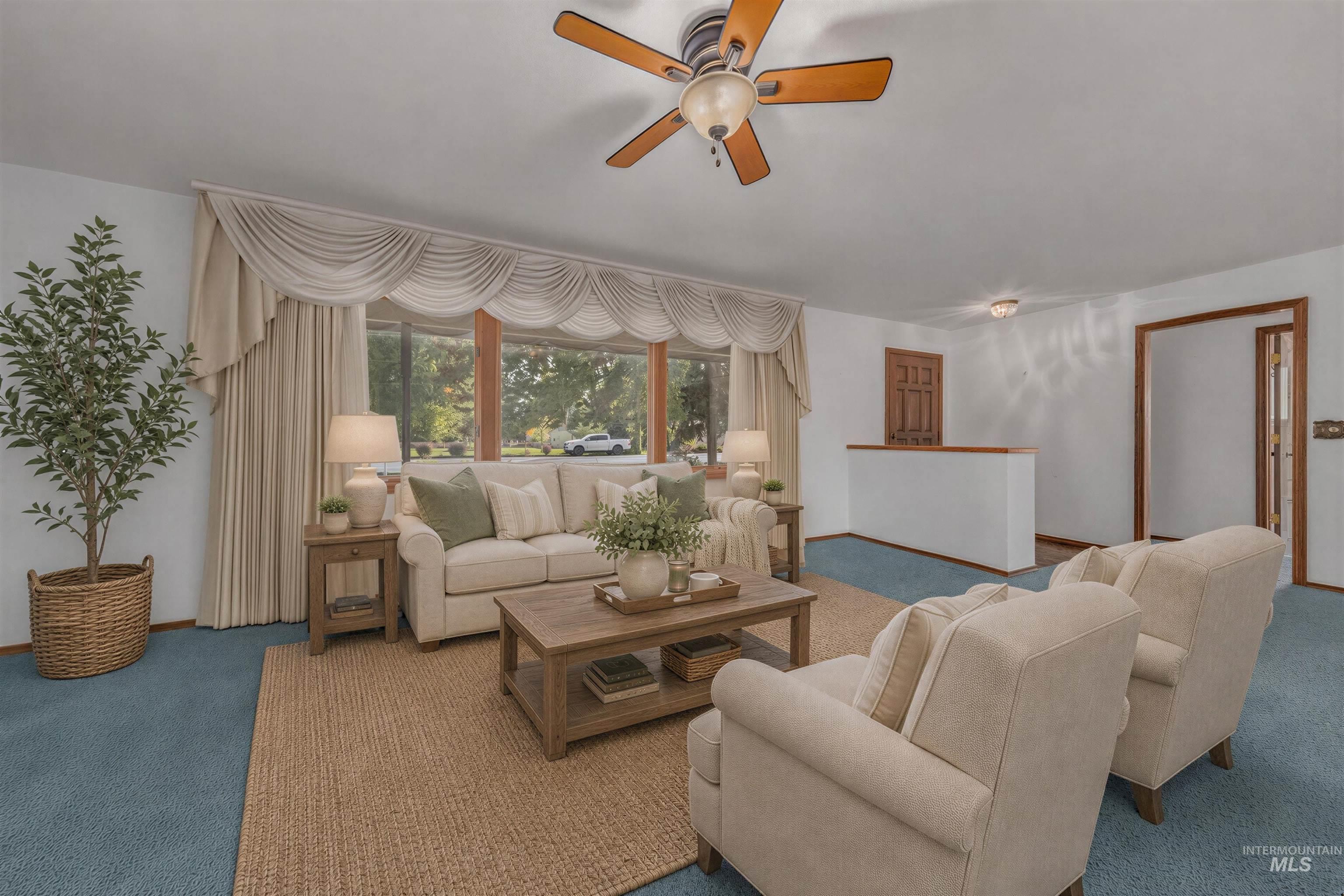 340 Pioneer Road Weiser, ID 83672 - Photo 6 of 44 Expansive window overlooking the exterior, with ceiling fan, and carpet flooring
