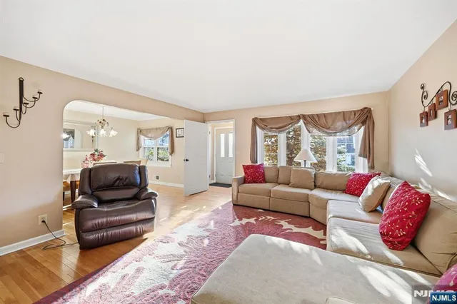 a view of a dining room with furniture and chandelier