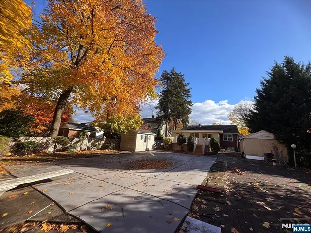 a view of street with parked cars