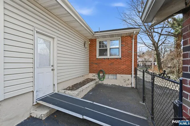 a view of a house with a patio and wooden flooring