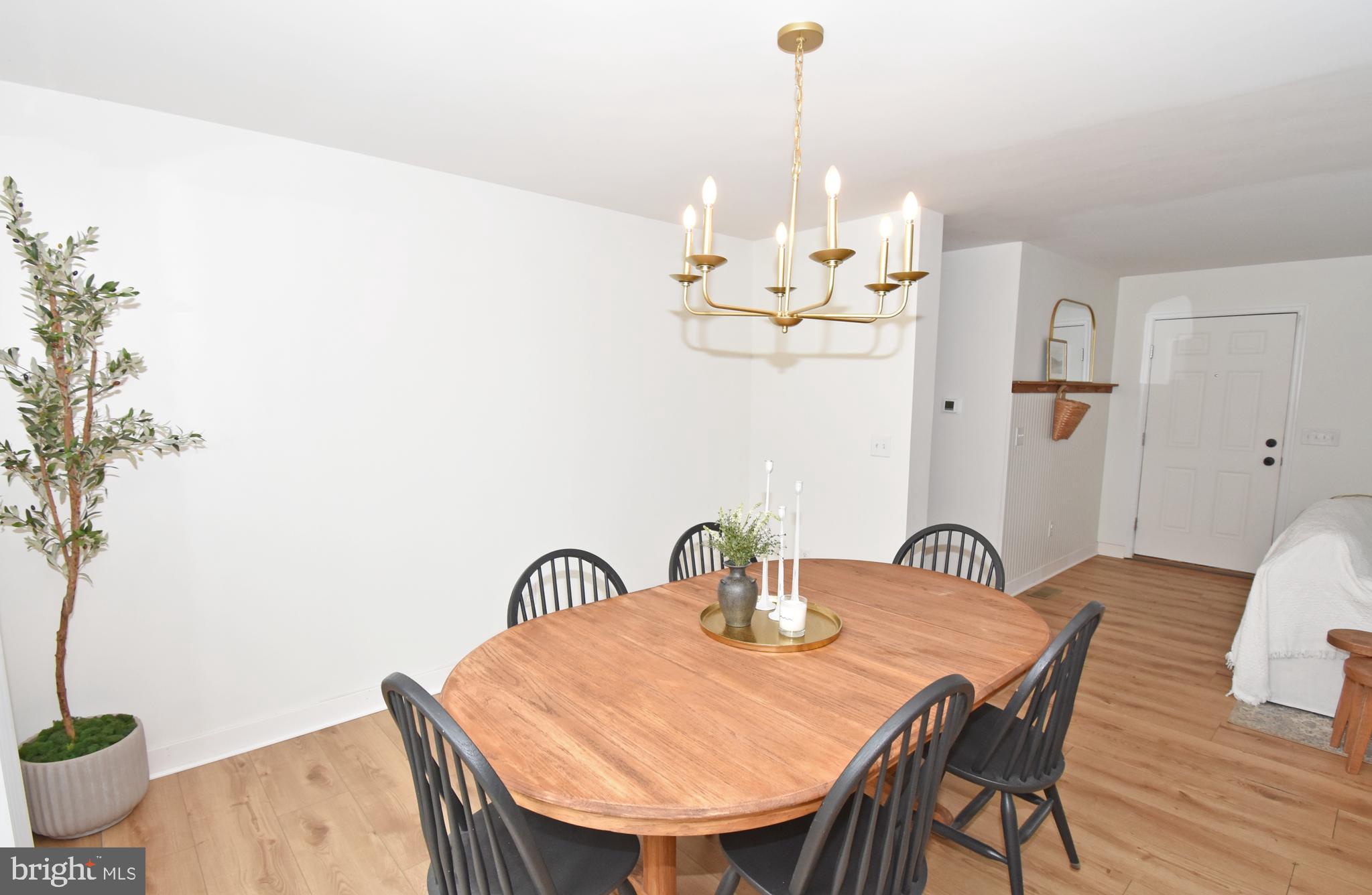 6600 Old Westover Marion Road Westover, MD 21871 - Photo 12 of 52 a view of a dining room with furniture and wooden floor
