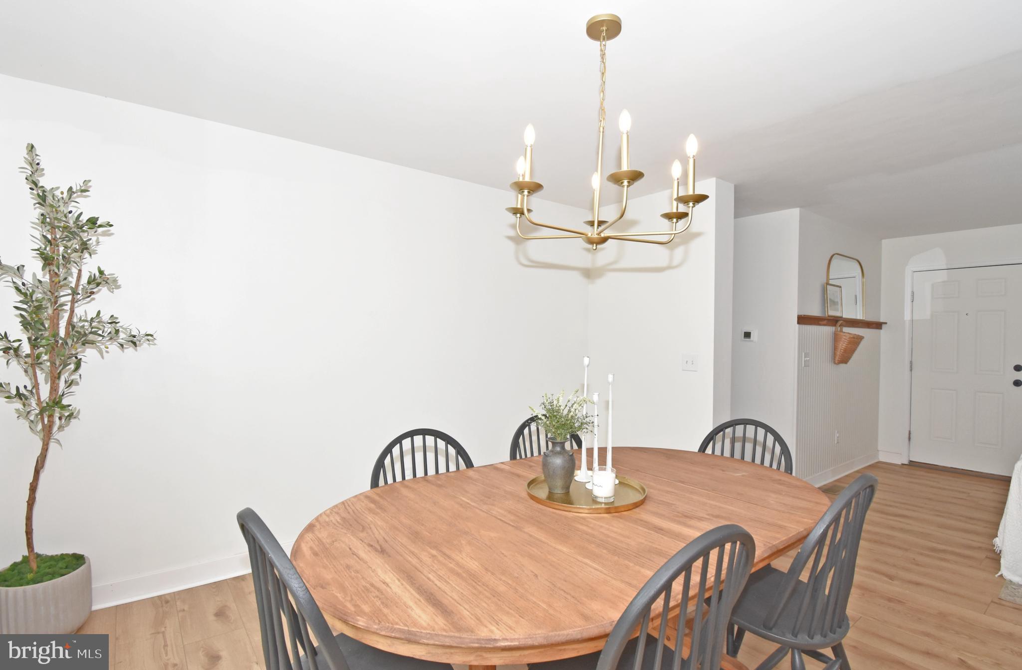 6600 Old Westover Marion Road Westover, MD 21871 - Photo 16 of 52 a dining room with furniture and wooden floor