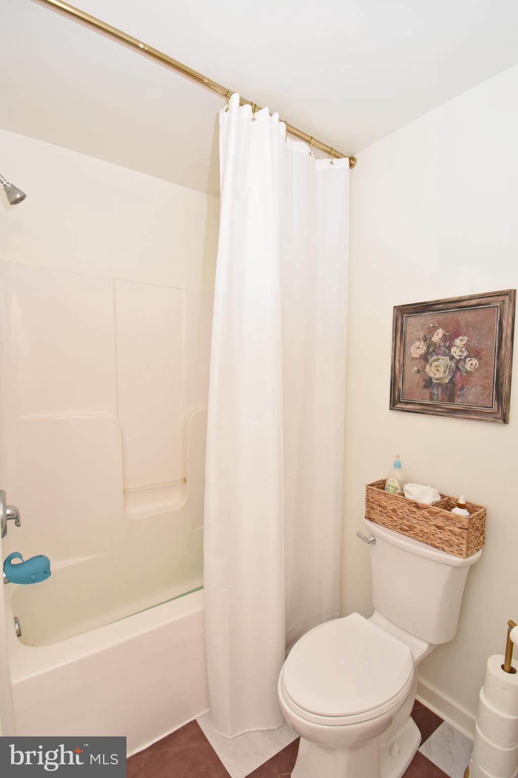 6600 Old Westover Marion Road Westover, MD 21871 - Photo 19 of 52 a white toilet sitting next to a bath tub