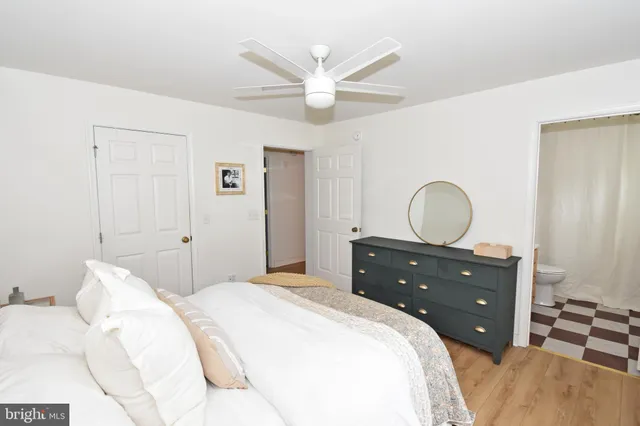 a bedroom with a bed and cabinets
