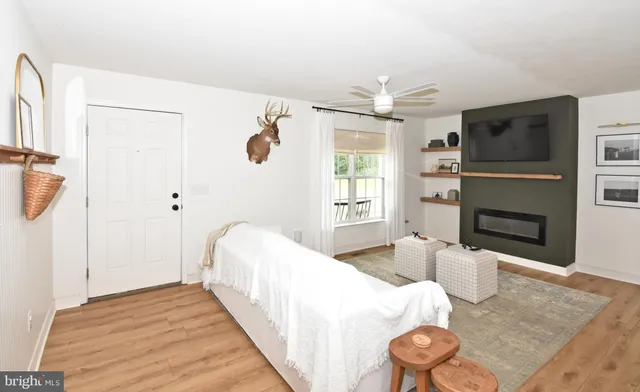 a bedroom with a bed and a chandelier