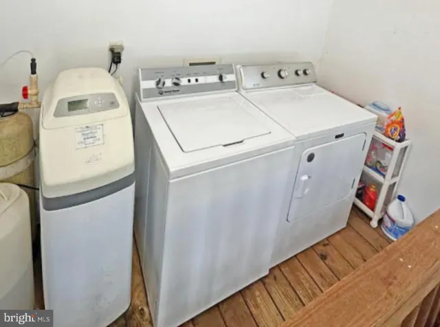a living room with lots of furniture and a book shelf