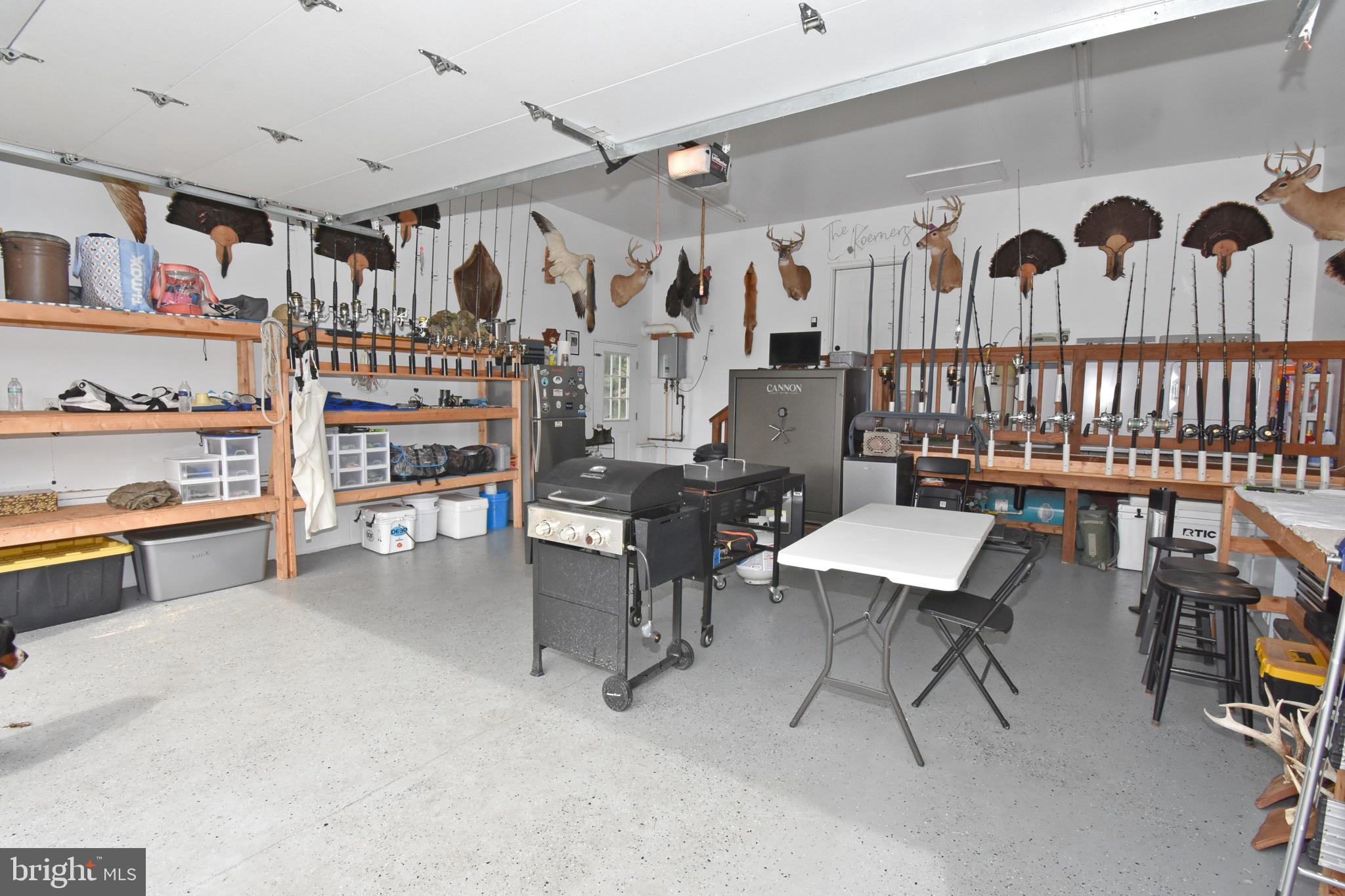 6600 Old Westover Marion Road Westover, MD 21871 - Photo 35 of 52 a living room with lots of furniture and a book shelf