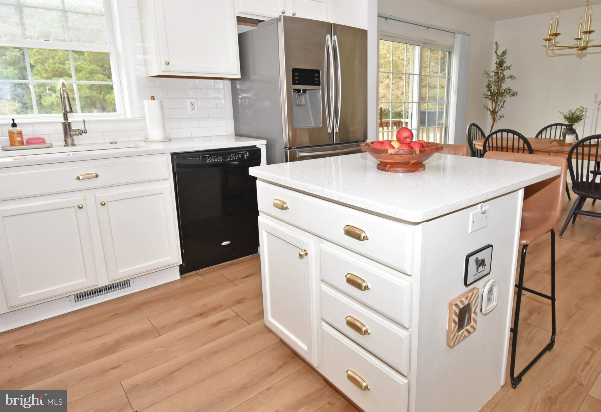 6600 Old Westover Marion Road Westover, MD 21871 - Photo 8 of 52 a kitchen with stainless steel appliances a sink cabinets and a window