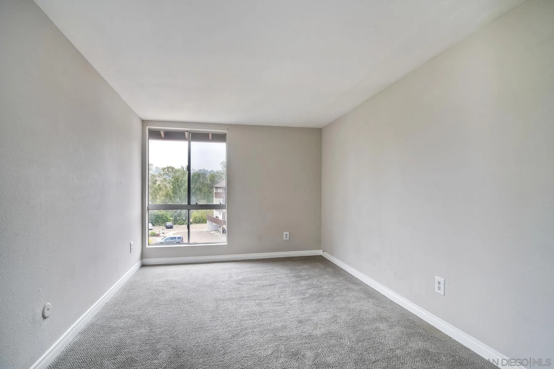 6151 Rancho Mission Road, Unit 317 San Diego, CA 92108 - Photo 13 of 31 an empty room with windows