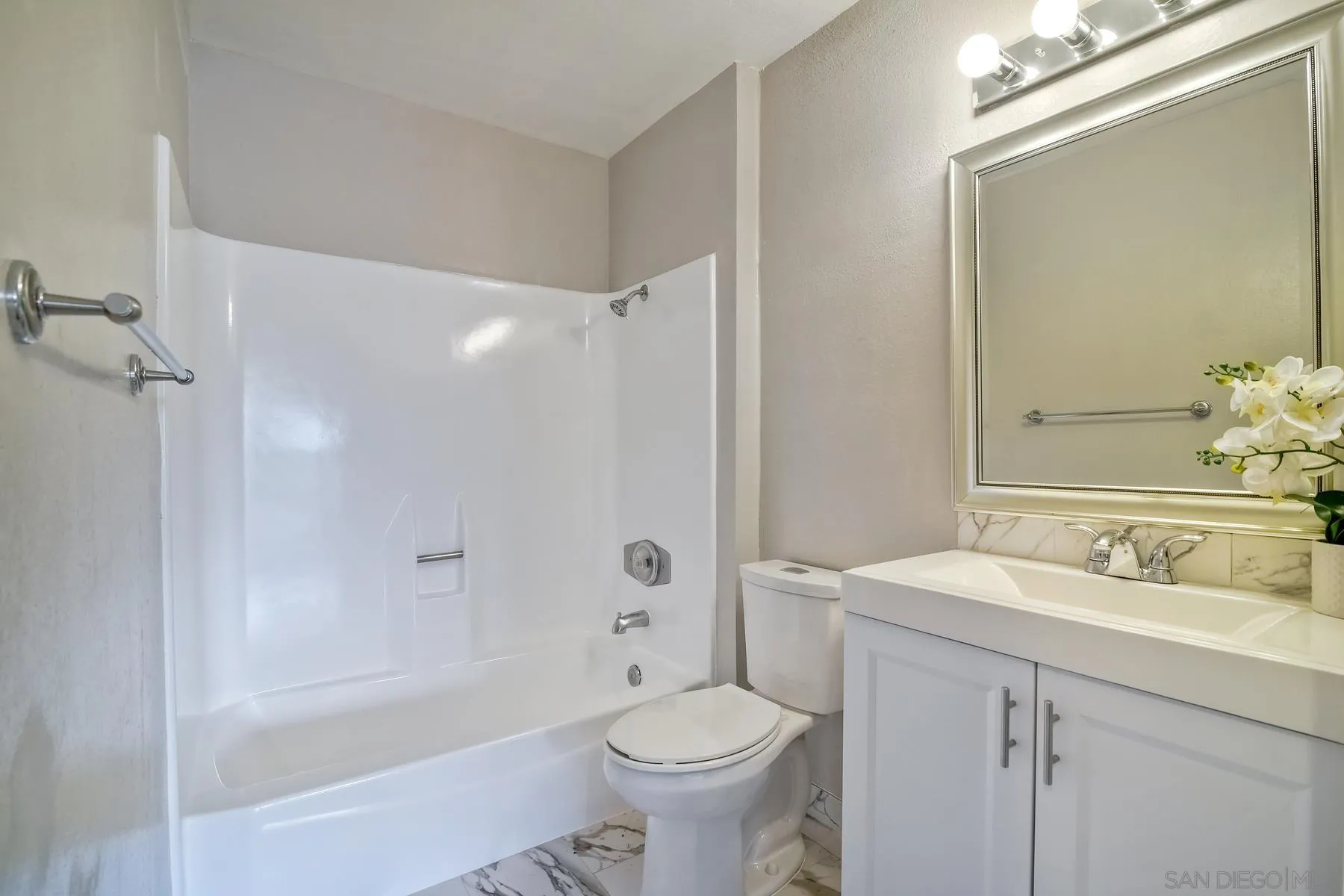 6151 Rancho Mission Road, Unit 317 San Diego, CA 92108 - Photo 14 of 31 a bathroom with a sink a toilet and shower