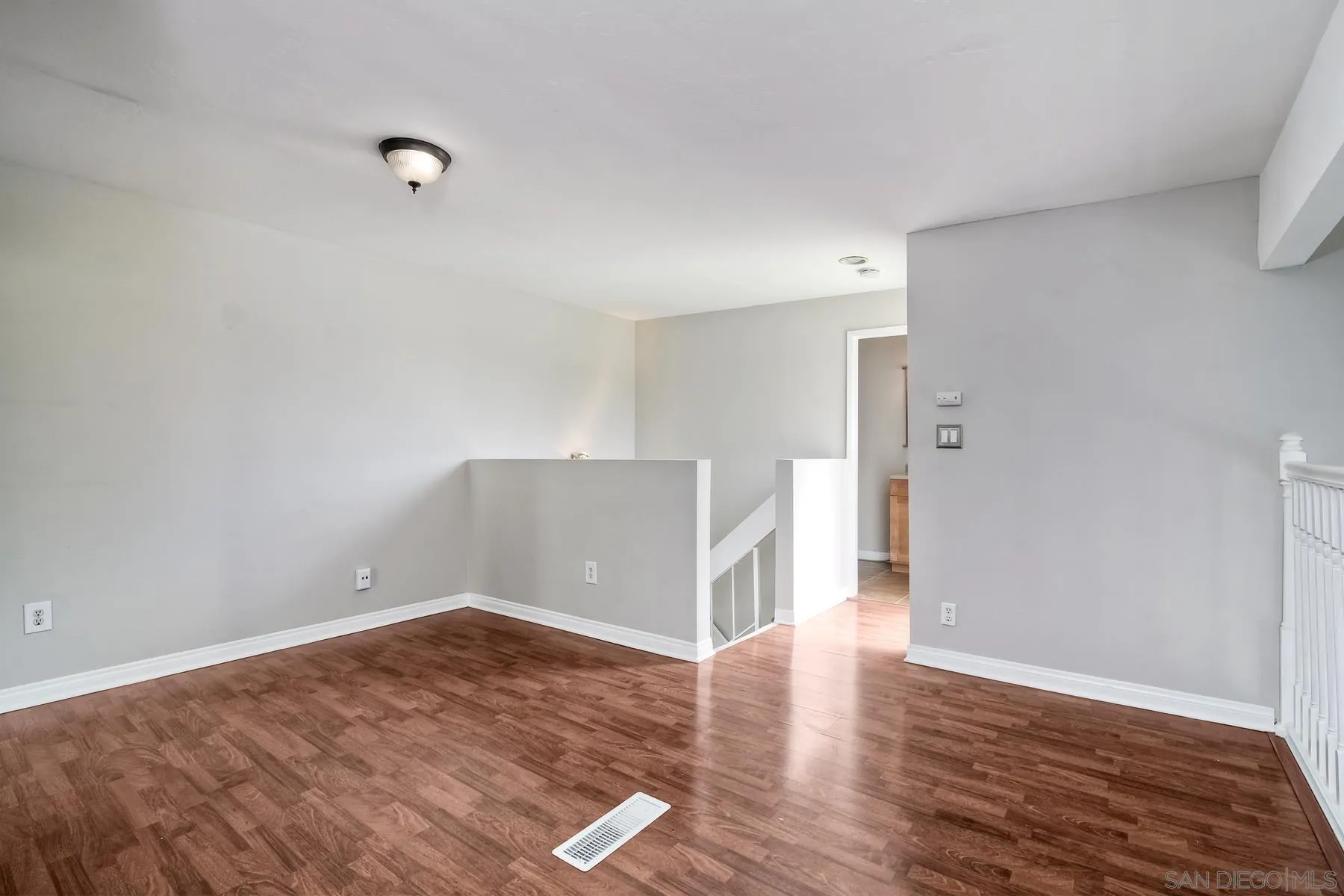 6151 Rancho Mission Road, Unit 317 San Diego, CA 92108 - Photo 17 of 31 a view of empty room with wooden floor