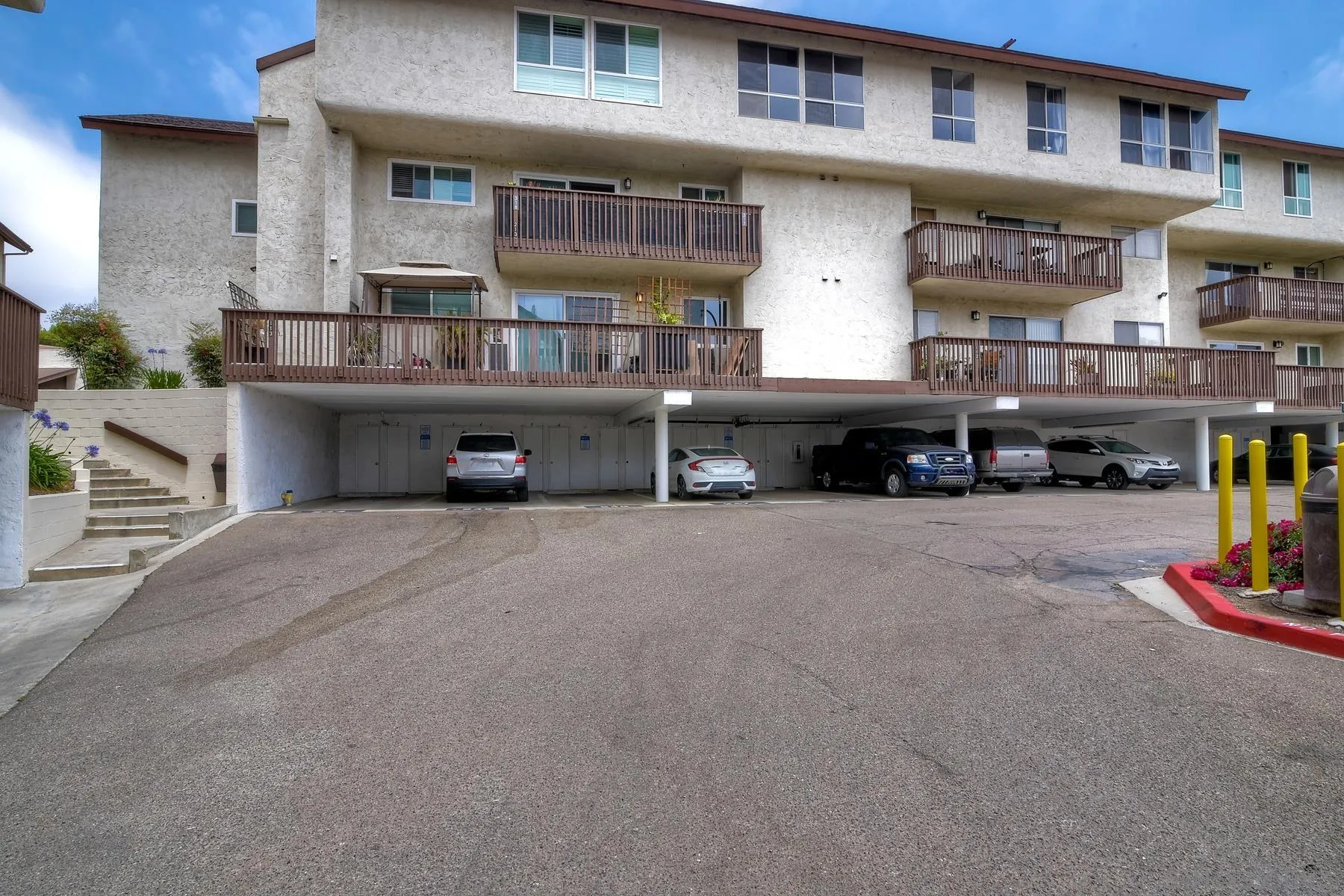 6151 Rancho Mission Road, Unit 317 San Diego, CA 92108 - Photo 24 of 31 a car parked in front of a building