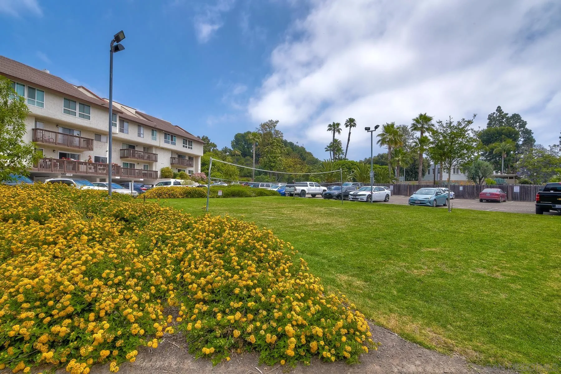 6151 Rancho Mission Road, Unit 317 San Diego, CA 92108 - Photo 25 of 31 a view of a big yard with a table and chairs