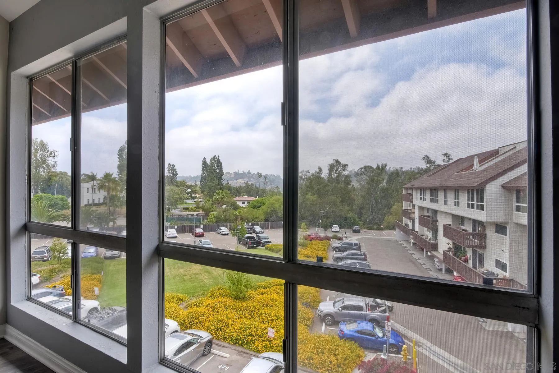 6151 Rancho Mission Road, Unit 317 San Diego, CA 92108 - Photo 8 of 31 a view of a city from a window