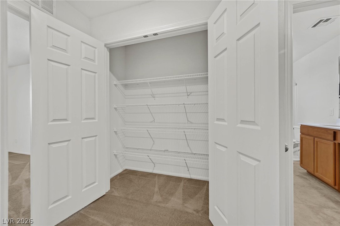 155 Fulgora Street Henderson, NV 89074 - Photo 16 of 30 Maximizing storage, this closet features multiple wire shelves, ideal for organization.