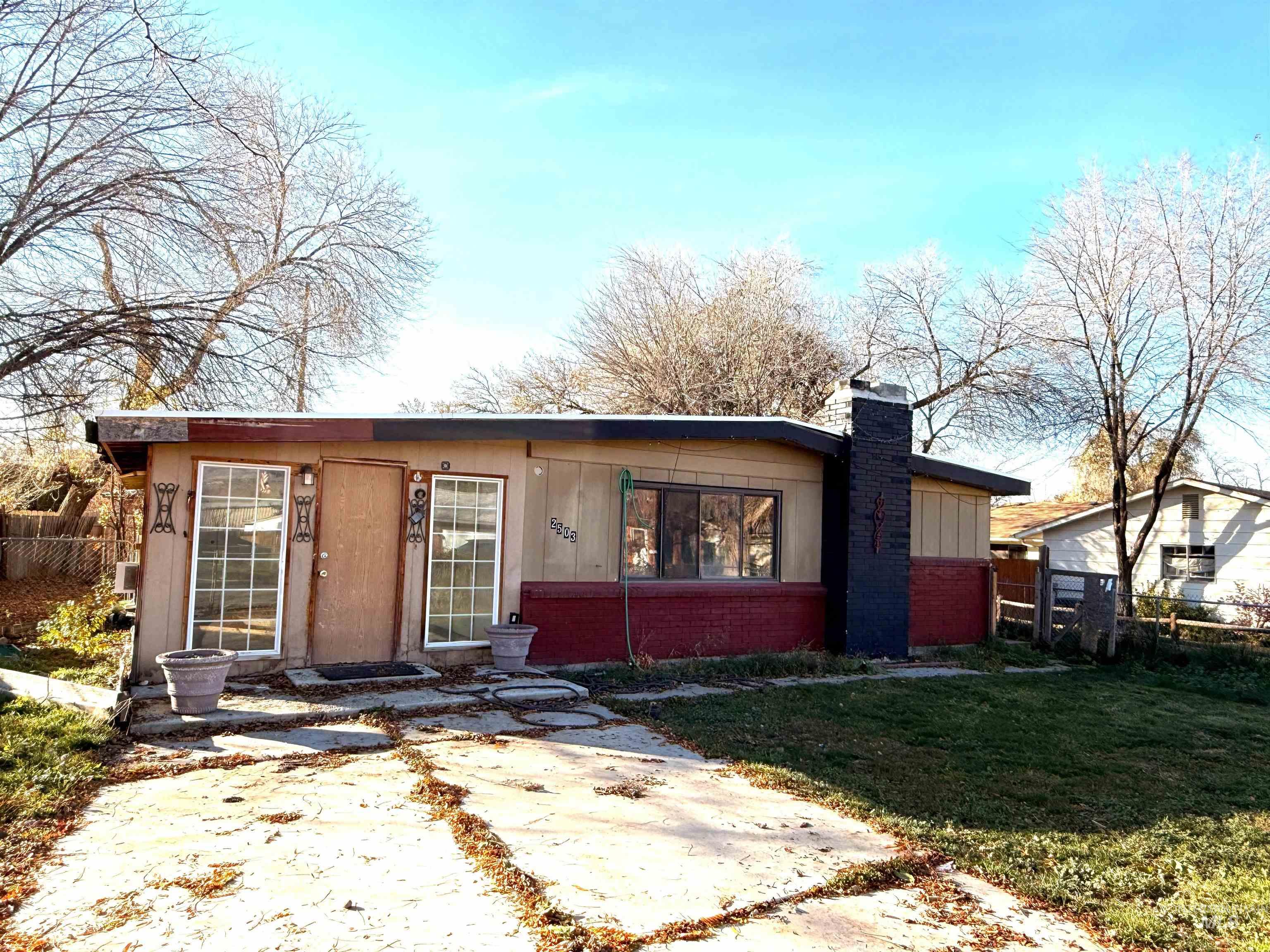 2503 South Virginia Street Boise, ID 83705 - Photo 1 of 1 View of front facade featuring brick siding and a chimney