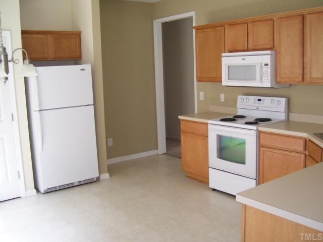 3544 Sunbright Lane Raleigh, NC 27610 - Photo 3 of 9 a utility room with sink dryer and washer