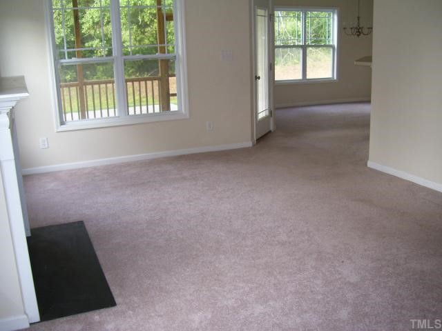 3544 Sunbright Lane Raleigh, NC 27610 - Photo 4 of 9 an empty room with windows