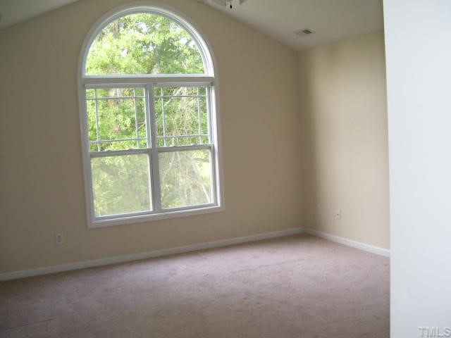 3544 Sunbright Lane Raleigh, NC 27610 - Photo 6 of 9 an empty room with a window