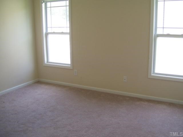 3544 Sunbright Lane Raleigh, NC 27610 - Photo 8 of 9 an empty room with a window