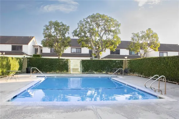 a view of a swimming pool with a patio