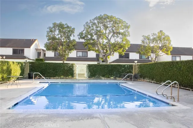 a view of a swimming pool with a patio