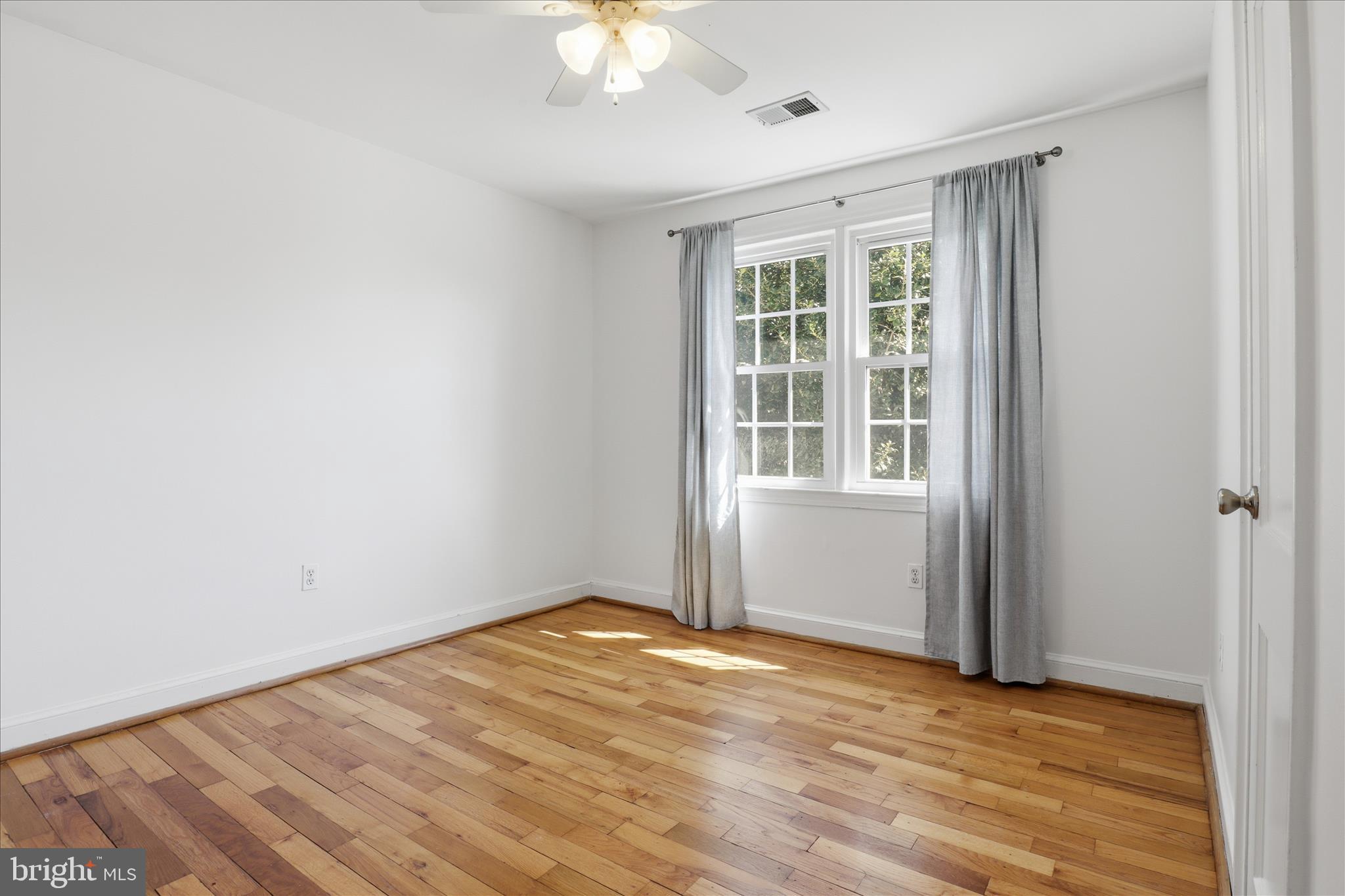 1305 South Walter Reed Drive, Unit 201 Arlington, VA 22204 - Photo 11 of 17 Large windows overlooking pool and backyard