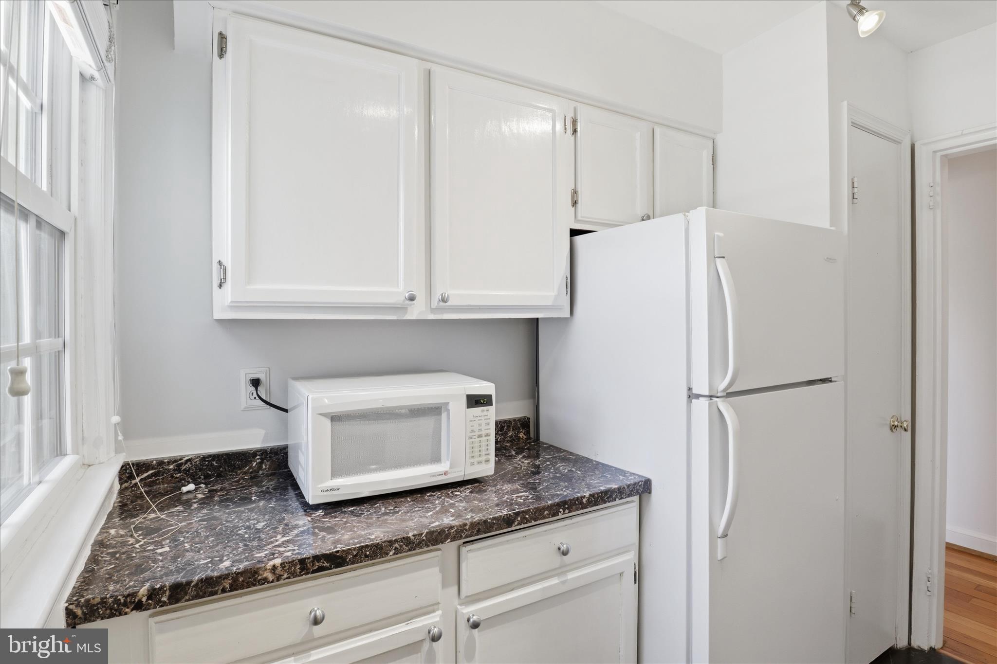 1305 South Walter Reed Drive, Unit 201 Arlington, VA 22204 - Photo 6 of 17 Well-designed kitchen with full-size pantry