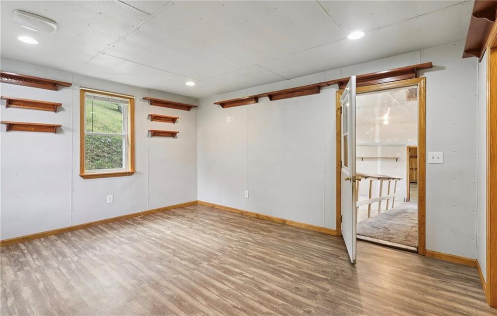 487 East Brady Road Kittanning, PA 16201 - Photo 22 of 50 a view of an empty room with wooden floor and a window